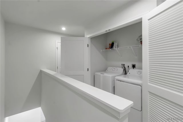clothes washing area with laundry area, recessed lighting, and washer and dryer