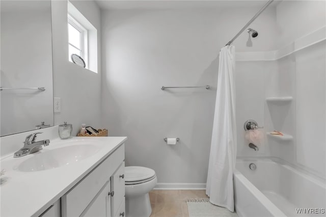 full bathroom with shower / bath combo, tile patterned floors, baseboards, vanity, and toilet