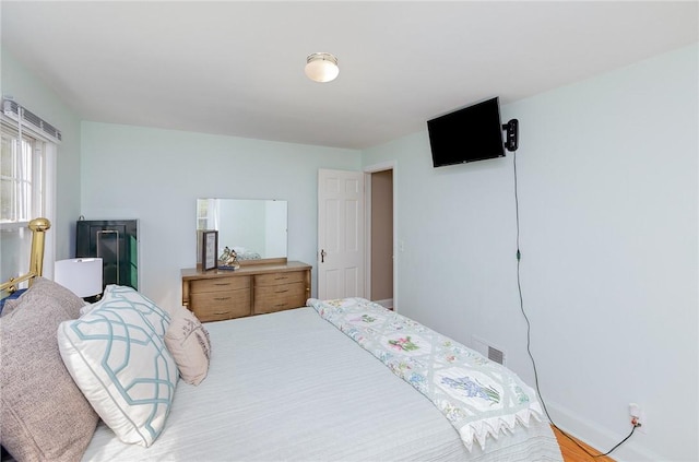 bedroom featuring visible vents