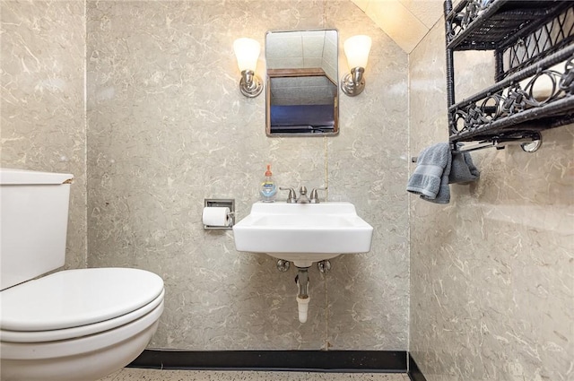 bathroom featuring toilet