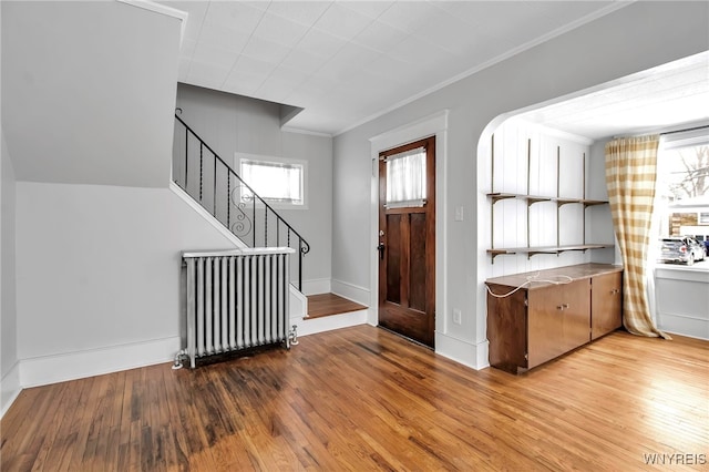 92 Carlyle Ave, Buffalo, NY 14220 - entryway with light wood-style floors, stairs, and ornamental molding
