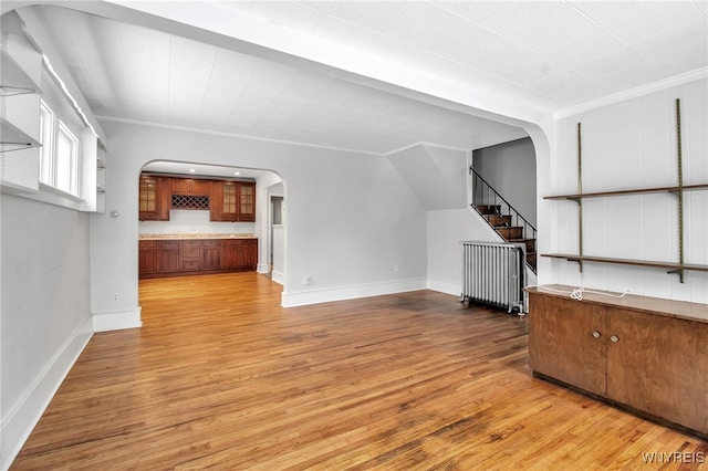 92 Carlyle Ave, Buffalo, NY 14220 - bonus room featuring arched walkways, light wood-style floors, and stairs
