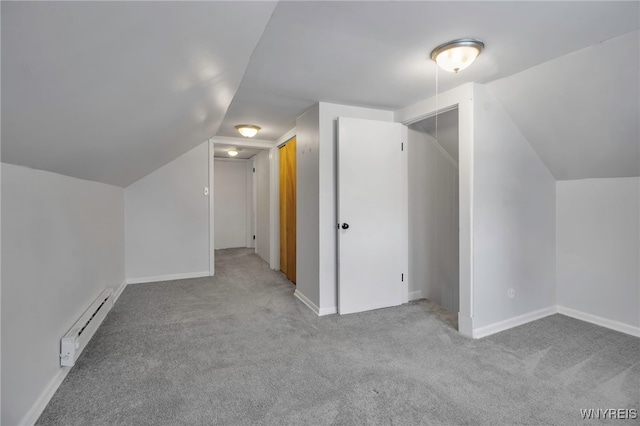 bonus room with vaulted ceiling, baseboards, a baseboard radiator, and carpet flooring