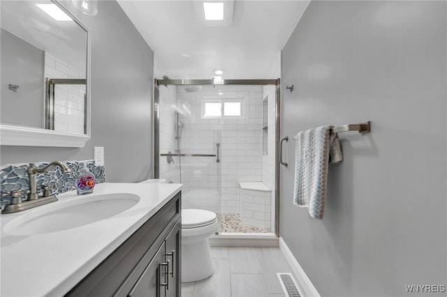 full bath featuring visible vents, tile patterned flooring, a stall shower, vanity, and toilet