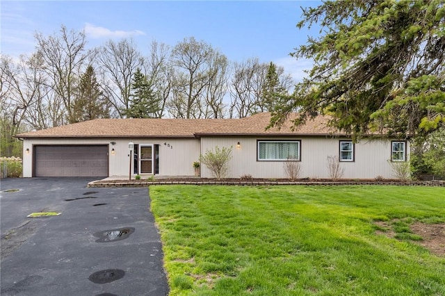 single story home with an attached garage, a front lawn, and aphalt driveway