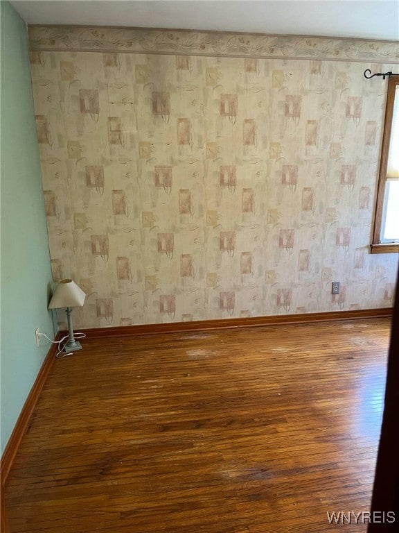 1266 91st St, Niagara Falls, NY 14304 - unfurnished room featuring wood finished floors and baseboards