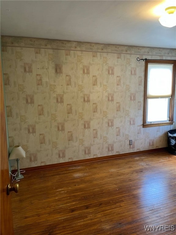 1266 91st St, Niagara Falls, NY 14304 - spare room with wood-type flooring and baseboards