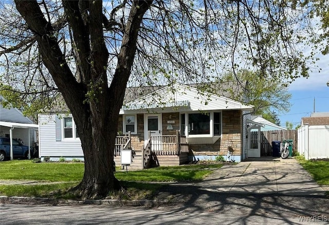 1266 91st St, Niagara Falls, NY 14304 - view of front facade with stone siding and concrete driveway