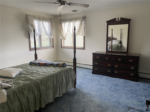 bedroom with carpet floors, ceiling fan, multiple windows, and baseboard heating