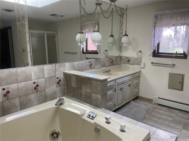 bathroom featuring visible vents, a stall shower, a tub with jets, vanity, and a baseboard heating unit