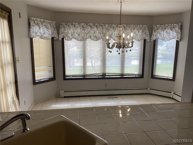 unfurnished dining area with plenty of natural light, a sink, and light tile patterned floors
