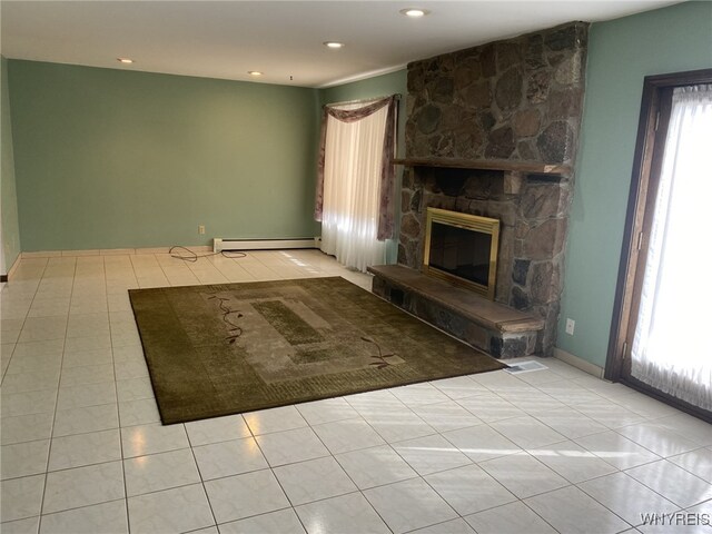 unfurnished living room featuring light tile patterned flooring, a fireplace, baseboards, recessed lighting, and a baseboard heating unit