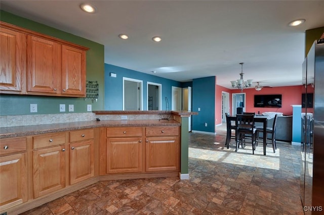 46139 County Route 191, Orleans, NY 13640 - kitchen featuring a peninsula, baseboards, recessed lighting, a chandelier, and stone finish flooring