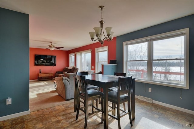 46139 County Route 191, Orleans, NY 13640 - dining space featuring stone finish flooring, baseboards, visible vents, and a healthy amount of sunlight