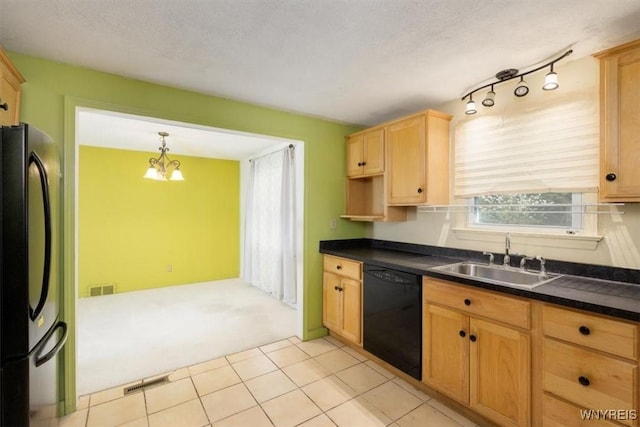 kitchen featuring dark countertops, refrigerator, light colored carpet, a sink, and dishwasher