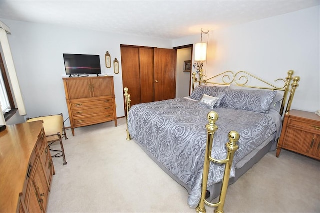bedroom with carpet floors and a closet