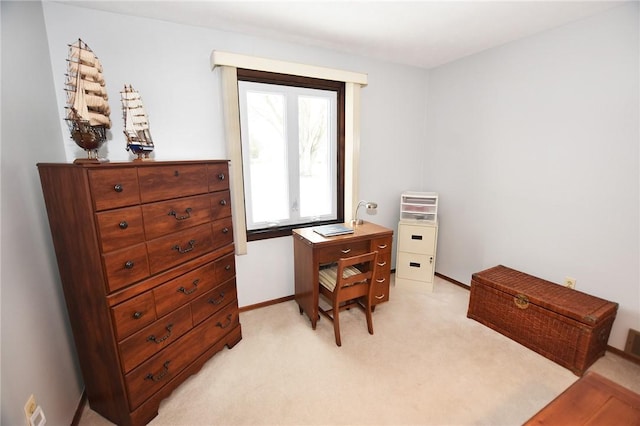 office featuring light colored carpet and baseboards