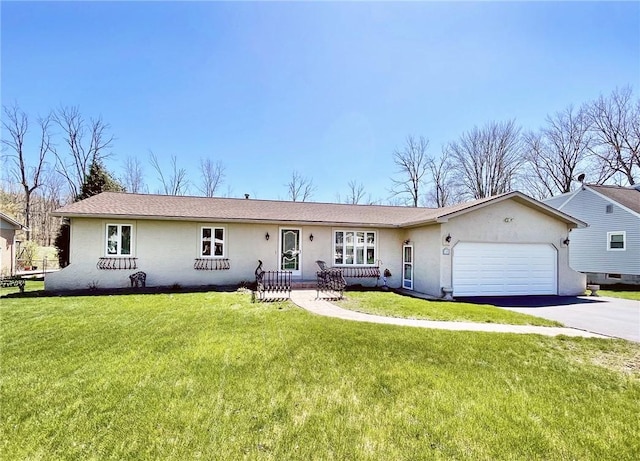 ranch-style house featuring stucco siding, an attached garage, driveway, and a front lawn