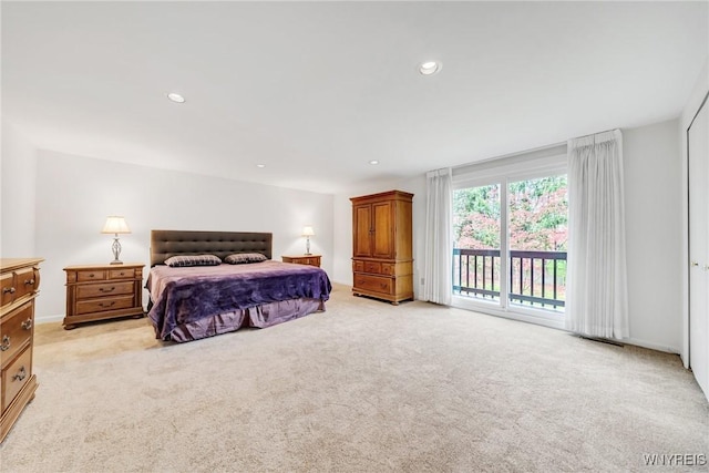 bedroom with visible vents, light colored carpet, recessed lighting, and access to exterior