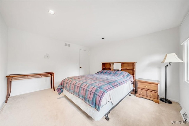 carpeted bedroom with recessed lighting, baseboards, and visible vents