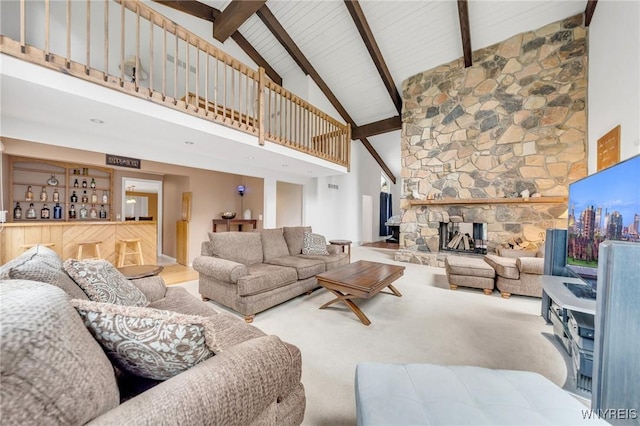 living room featuring beamed ceiling, high vaulted ceiling, carpet flooring, and a fireplace