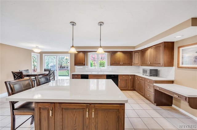 kitchen featuring decorative backsplash, brown cabinetry, light tile patterned flooring, and dishwasher