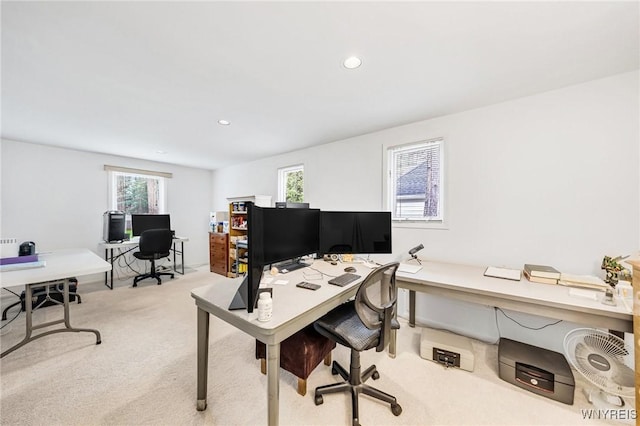 office space featuring a wealth of natural light, recessed lighting, and light colored carpet