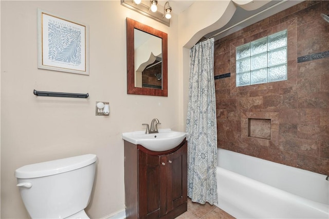 bathroom with vanity, tile patterned floors, shower / bath combination with curtain, and toilet