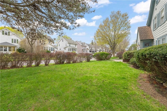 view of yard featuring a residential view