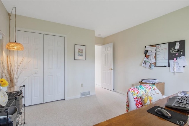 office area with baseboards, carpet flooring, and visible vents