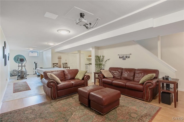living area featuring baseboards, billiards, light wood finished floors, and stairs