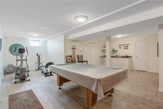 recreation room with baseboards, a sink, and billiards