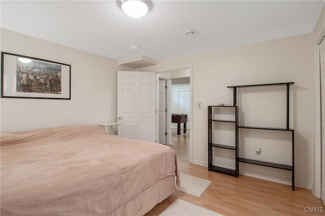 bedroom with light wood finished floors