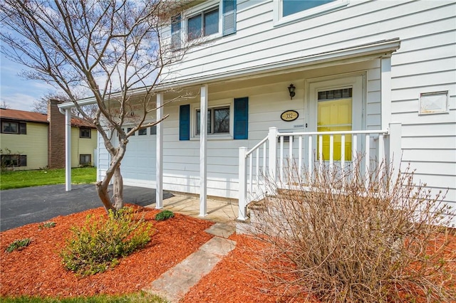 entrance to property with a garage and driveway