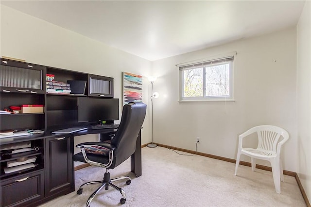 home office featuring baseboards and light colored carpet