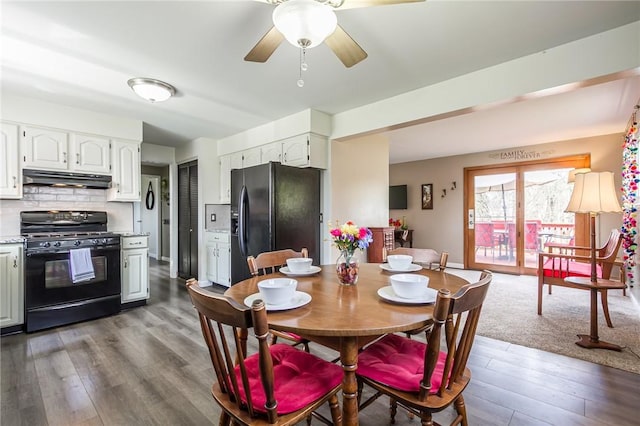 dining area featuring ceiling fan and dark wood-style floors