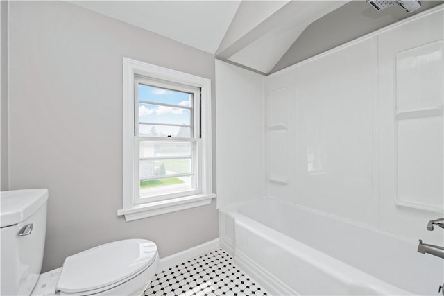 full bathroom with baseboards, lofted ceiling, bathtub / shower combination, and toilet