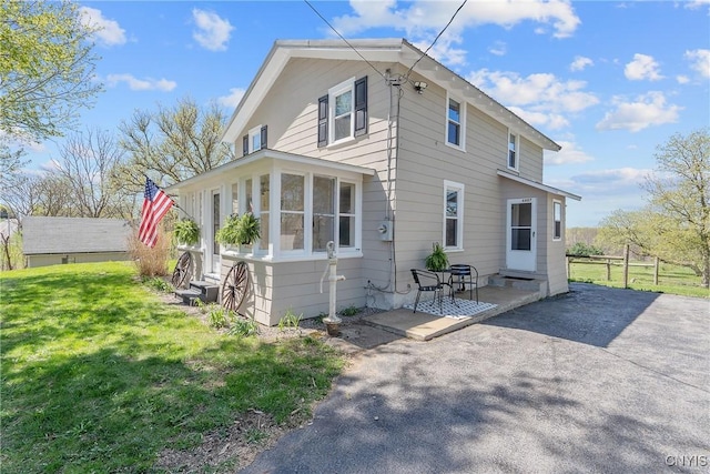 view of home's exterior featuring a yard and a patio area