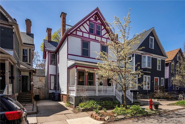 134 Mariner St, Buffalo, NY 14201 - view of front of property featuring covered porch and a chimney
