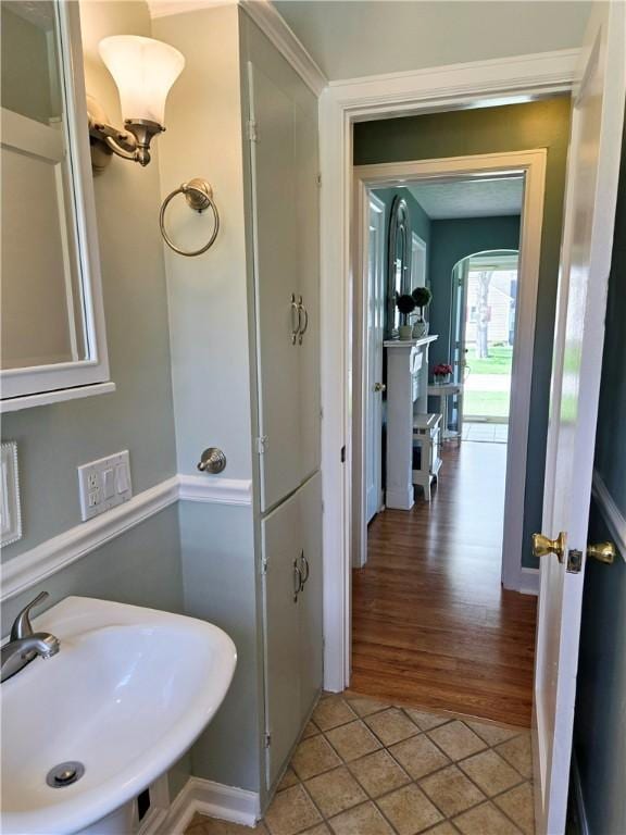 bathroom featuring tile patterned floors and a sink