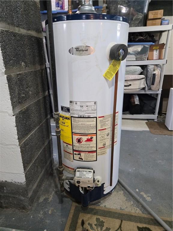 utility room with gas water heater