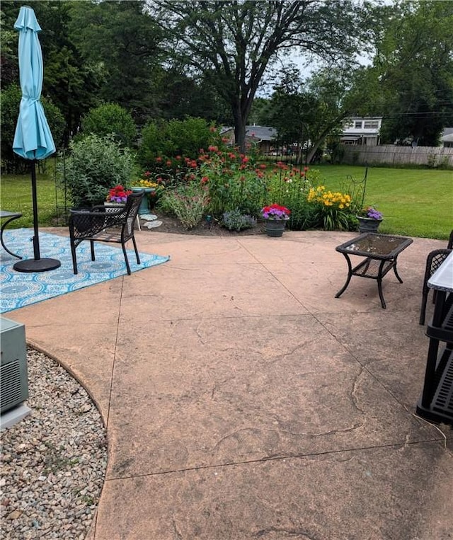 view of patio featuring fence
