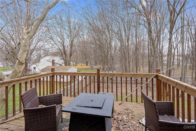 deck featuring an outdoor fire pit