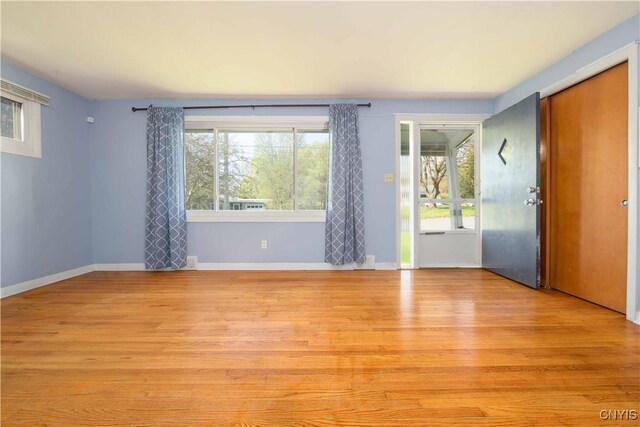216 Pine Grove St, Syracuse, NY 13210 - empty room with baseboards and light wood-style floors