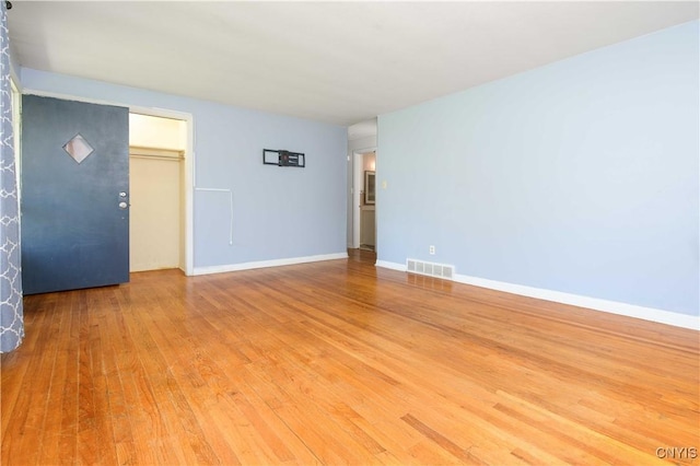 216 Pine Grove St, Syracuse, NY 13210 - unfurnished room with visible vents, light wood finished floors, and baseboards