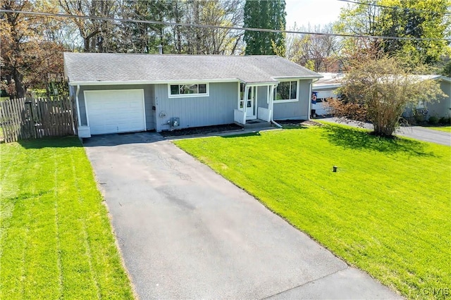 216 Pine Grove St, Syracuse, NY 13210 - ranch-style house featuring a garage, fence, driveway, and a front yard