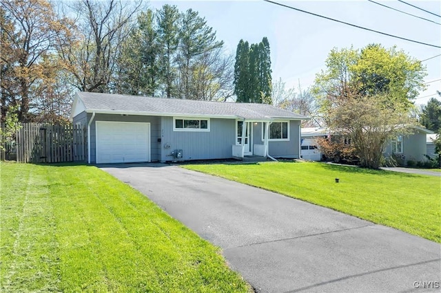 216 Pine Grove St, Syracuse, NY 13210 - ranch-style home featuring a garage, fence, a front yard, and aphalt driveway
