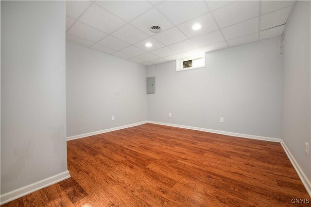 216 Pine Grove St, Syracuse, NY 13210 - empty room with recessed lighting, a drop ceiling, wood finished floors, and electric panel