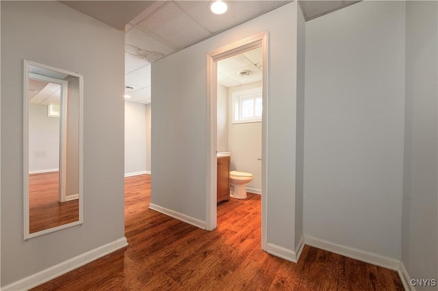 216 Pine Grove St, Syracuse, NY 13210 - corridor with baseboards, a paneled ceiling, and wood finished floors