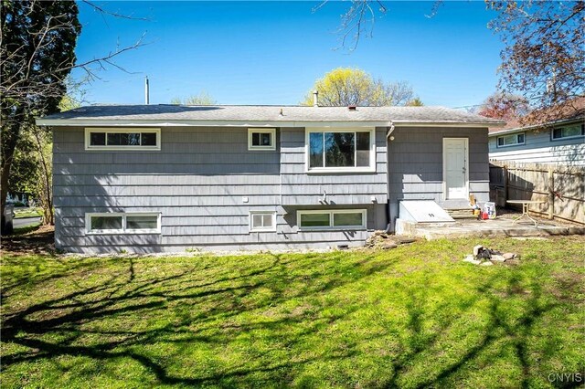 216 Pine Grove St, Syracuse, NY 13210 - rear view of property with fence and a yard